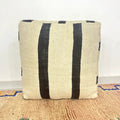 Handmade Moroccan kilim pouf featuring minimalist woven stripe bands, flatwoven Berber textile construction, and artisan handcrafted detailing